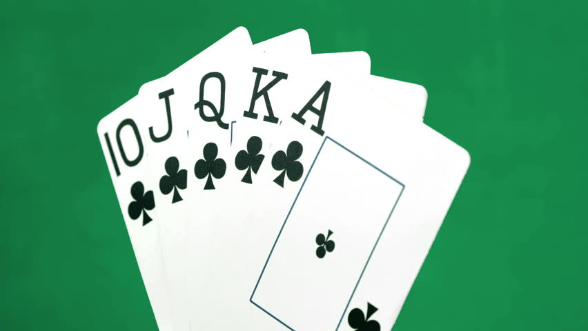  a full house of poker coming into frame  red and green background 