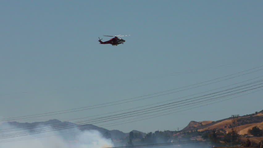 Wildfire in Southern California - Helicopter Preparing to Drop Water