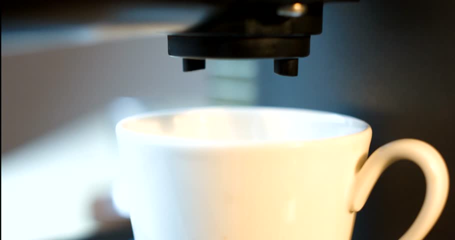 Steamy espresso shot pouring from coffee maker | Shutterstock HD Video #10038500