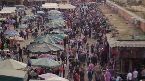 Marrakesh/Morocco – April 2015: tourism crowd square Djemaa El Fnaa