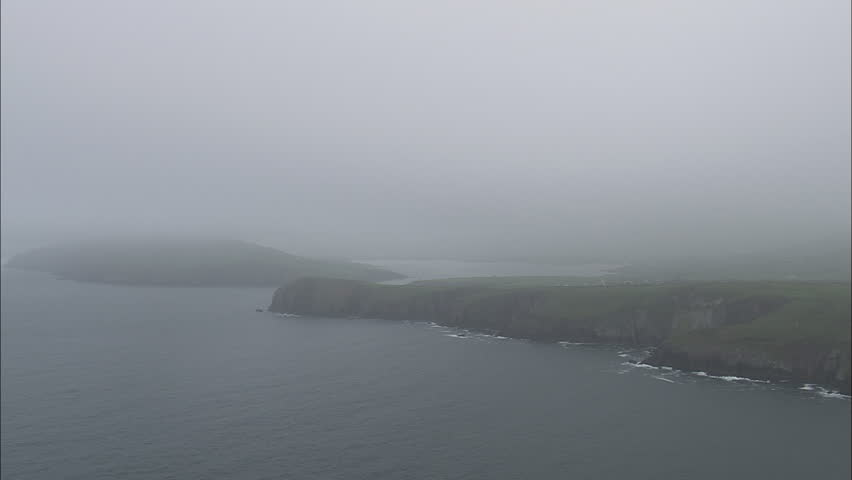 AERIAL Ireland-Rocky Coast On Dingle Bay 2006: Misty rocks on the north side of the Kerry Ring