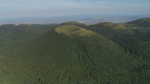 AERIAL France-Puy De Dome Area Of Old Volcanoes 2006: Volcanoes with wooded sides at Puy de Dome volcano region