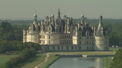 AERIAL France-Flight Over Chateau De Chambord 2006: Chateau Chambord approach, tight and low, then rising up and pan round