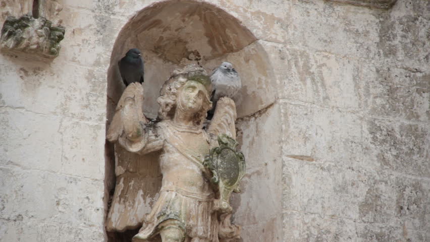 Two birds on a statue