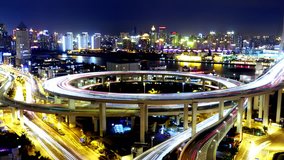 4k video,Timelapse of driving & cars racing by with streaking purple lights trail on overpass bridge at night in shanghai with super long exposures for each frame,urban morden building. gh2_07717_4k