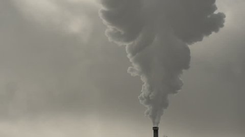 Slowmotion steam close up from chimney of a geothermal power station in Iceland on a sunny winter day