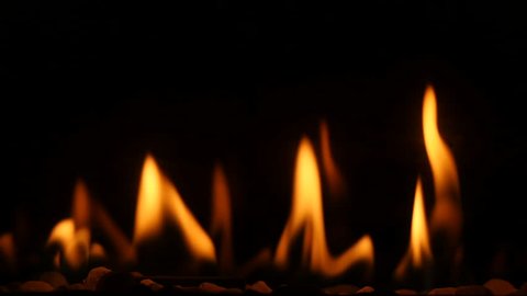 Close up of a gas fireplace burning with warm and comforting flames