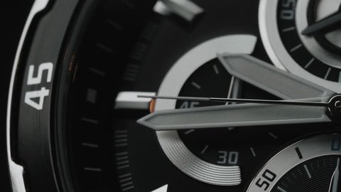 Mens Chronograph Swiss Watch made metal with sapphire glass. Close-up black studio macro video