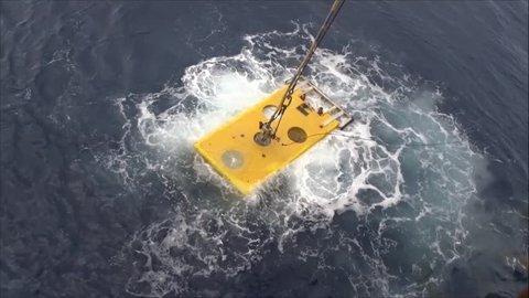Remote Operated Vehicle (ROV) floating and ready to dive for oil and gas pipeline inspection in the South China Sea. 