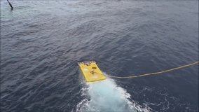 Remote Operated Vehicle (ROV) floating and ready to dive for oil and gas pipeline inspection in the South China Sea.  - Powered by Shutterstock - Get 15% off with code: PIKWIZARD15