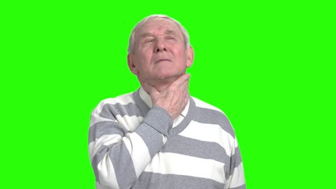 Old man has thore throat and coughing. Grandpa got a flu, green hroma background.