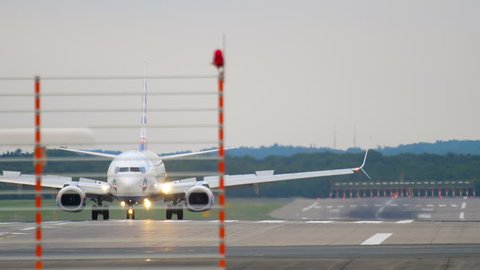 DUSSELDORF, GERMANY - JULY 22, 2017: SunExpress Boeing 737 TC-SEK braking after landing. Dusseldorf Airport, Germany