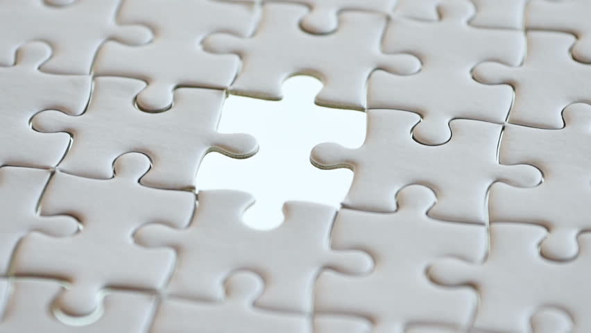last piece of white plain jigsaw filling by hand, step of success concept Royalty-Free Stock Footage #1005611509