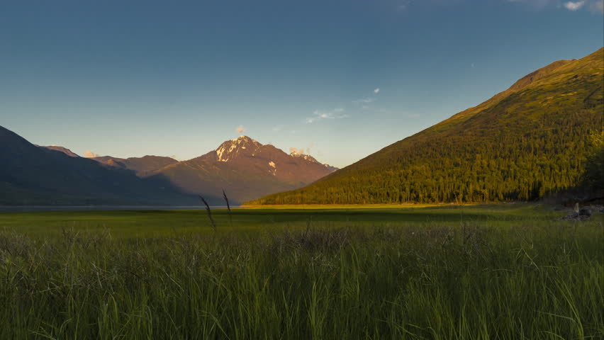 Sunset time lapse with mountains over Euklitna lake in Alaska, Anchorage