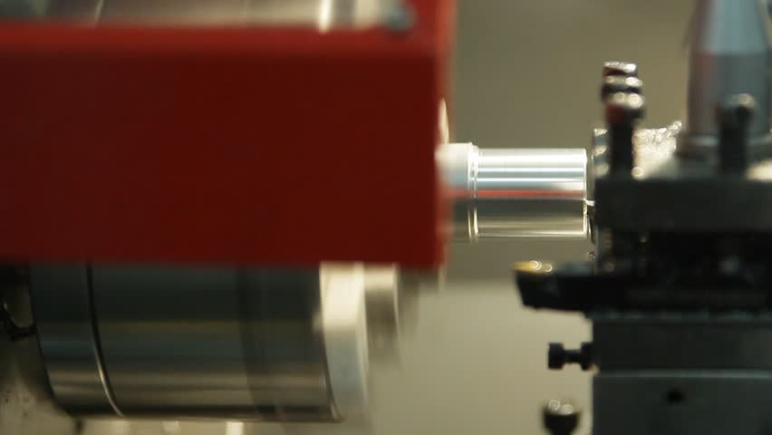 The processing of billets on the lathe is being processed. Metal shavings are formed | Shutterstock HD Video #1005616837