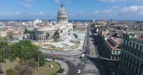Drone flying over Old Havana, Cuba: Capitolio monument and Habana Vieja district. Aerial view of La Habana, Cuban capital city. Urban landscape from the sky with buildings, homes, houses, cars