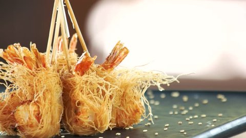 Shrimp tempura close up. Fried prawns, kataifi dough.