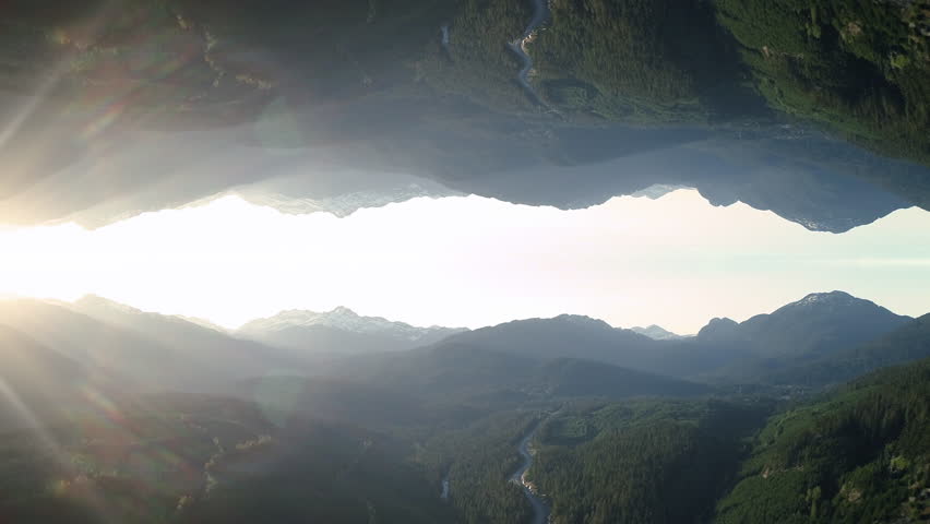 Abstract Road Trip Aerial of Mountain Forest Road Mirrored with Lens Flare