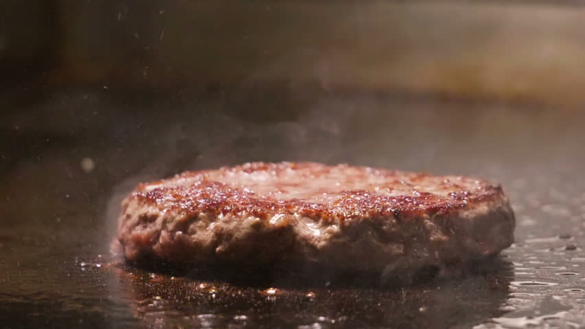 Cooking beef and pork patty for burger. Meat roasted at kitchen. Slow motion. HD Royalty-Free Stock Footage #1006585936