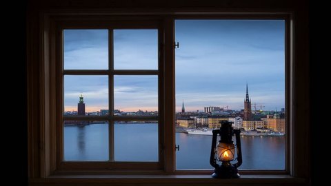 Timelapse of the City Hall and the island Riddarholmen in central Stockholm seen through a window.