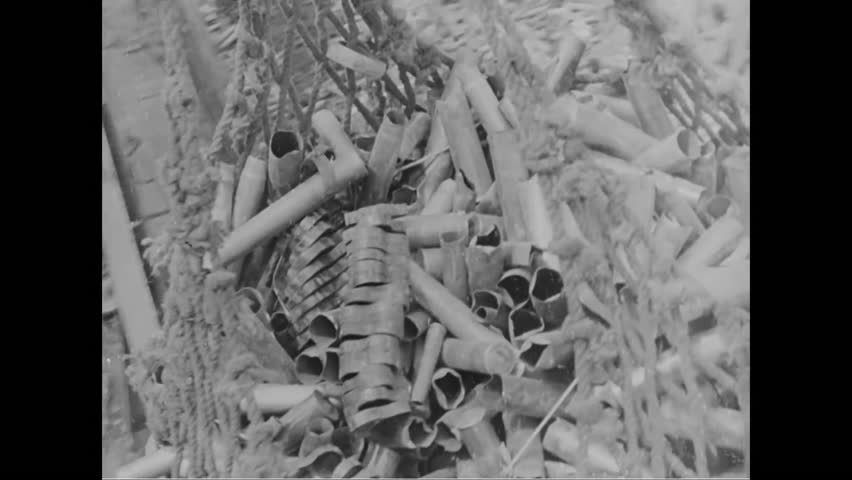 CIRCA - 1944 - Bombs are loaded into an Allied warplane an American bomber bombs a bridge during World War 2.