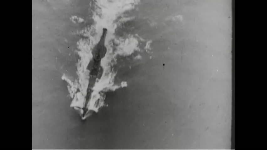 CIRCA - 1944 - A submarine, warplanes, ambulances and tanks, tires and bombs made in factories are shown during World War 2.