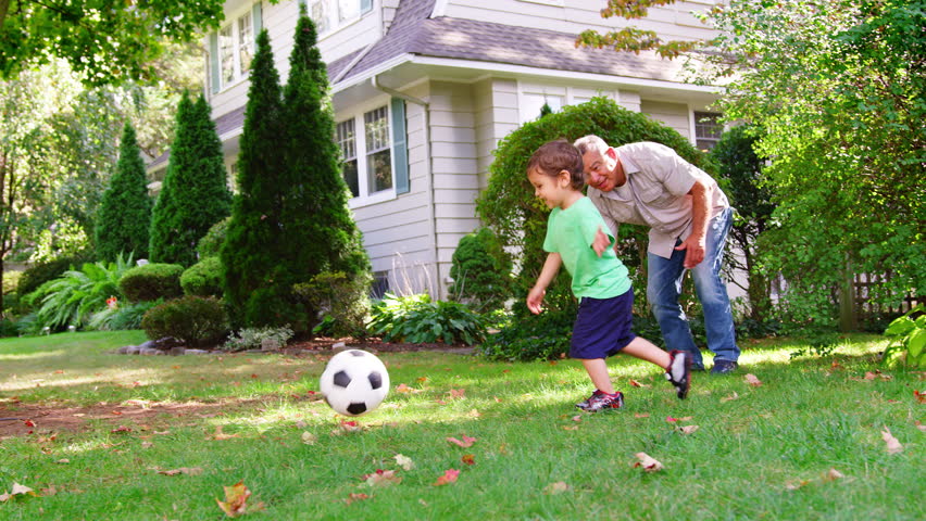 Grandfather Playing Soccer In Garden With Grandson Royalty-Free Stock Footage #1006597921
