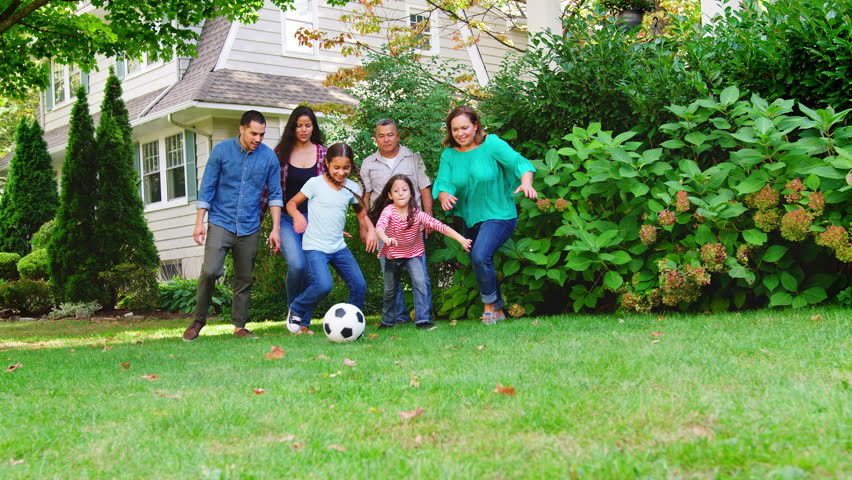 Multi Generation Family Playing Soccer In Garden Royalty-Free Stock Footage #1006597930
