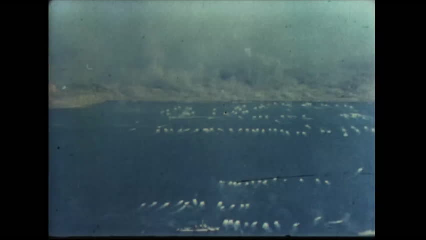 CIRCA - 1945 - As US soldiers land on the shores of Iwo Jima