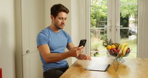 4K Entrepreneur working at home, making video call to a colleague on smartphone