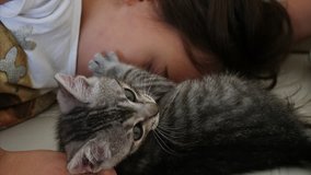 Cute girl cuddling with her furry friend