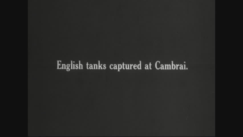 CIRCA 1910s - German troops walk around and disassemble British tanks put out of commission by German Forces.
