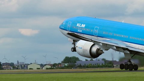AMSTERDAM, NETHERLANDS - JULY 26, 2017: Boeing 777 PH-BQL of KLM Asia airlines is gaining altitude right after it detached from the ground