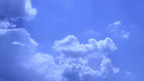 Blue clean sky & puffy white clouds motion, time lapse beautiful real horizon in sunny nice day. Time lapse clip of white fluffy clouds over blue sky, White clouds running over blue sky. UHD, 4K.