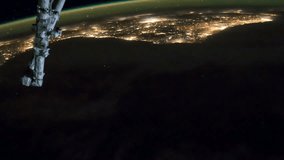 ISS view of rotating planet earth with aurora and star galaxy. Created from Public Domain images, courtesy of NASA JSC : http://eol.jsc.nasa.gov. Zoom out