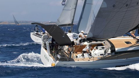 PORTO ROTONDO – JUNE 4: Sailing boats navigate on choppy sea during Solaris Cup regatta on June 4, 2017, in Porto Rotondo, Italy