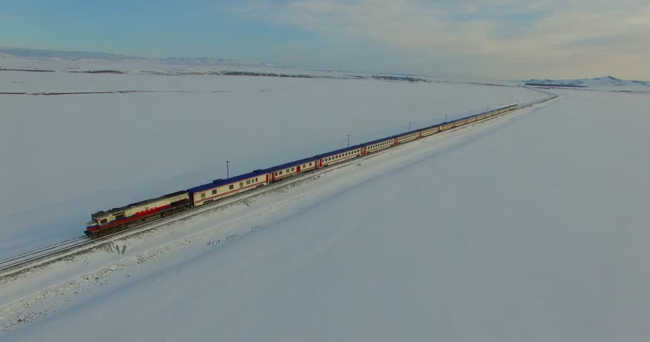 Aerial shot of a snowy place with train(Eastern Express) passing, Kars/Turkey Royalty-Free Stock Footage #1006627888