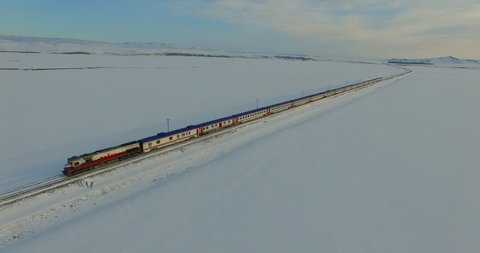 Aerial shot of a snowy place with train(Eastern Express) passing, Kars/Turkey Video de stock