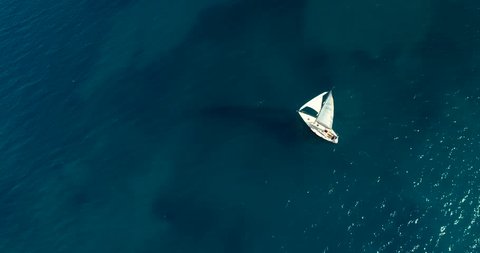 Yacht sailing on opened sea. Sailing boat. Yacht cinematic 4k view from drone. Yachting video footage. Yacht from above. Sailboat view from drone. Sailing video 