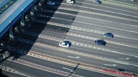 Drone view car traffic on checkpoint at toll road in modern city aerial view. Car driving on toll road for high speed and comfortable driving without traffic jams
