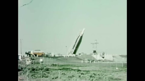 CIRCA 1962 - A missile is brought up from an underground silo.