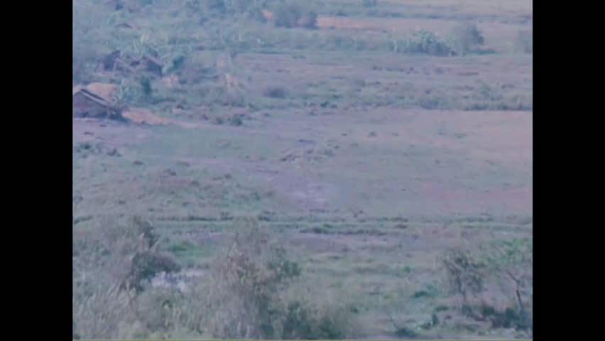 CIRCA 2010s - Napalm is dropped on villages during the Vietnam War causing massive fireballs and destruction.