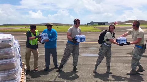 CIRCA 2010s - Water and relief supplies are delivered to victims of Hurricane Maria in Puerto Rico by the U.S. aid agencies.
