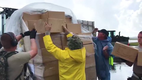 CIRCA 2010s - Water and relief supplies are delivered to victims of Hurricane Maria in Puerto Rico by the U.S. aid agencies.