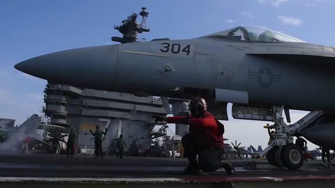 CIRCA 2010s - Navy jets take off from a U.S. aircraft carrier.