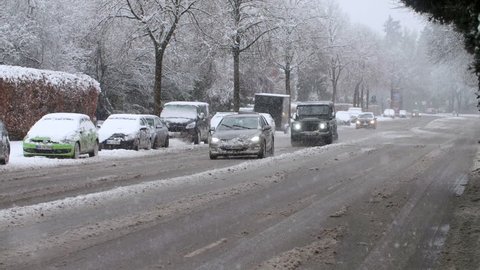20% of realtime slow motion shot of a heavy snowfall in Hamburg with traffic