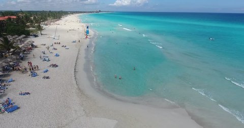 Drone flying over Varadero, Cuba. Aerial view of Cuban beach and Caribbean Sea. Landscape seen from the sky with ocean waters. Travel destination for people, tourists, holidays and fun