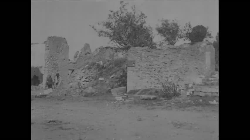 CIRCA 1918 - Severely destroyed buildings and cavalry soldiers in St. Mihiel, France after the battle in WWI.