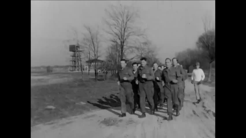 CIRCA 1955 - American and German paratroopers train together.