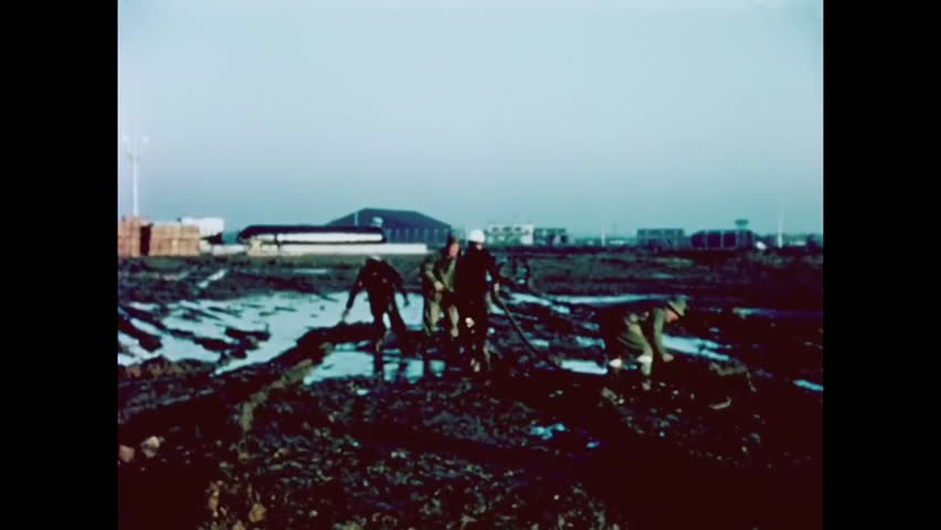 CIRCA 1960 - RAF operators man the grounds of an overseas American missile.